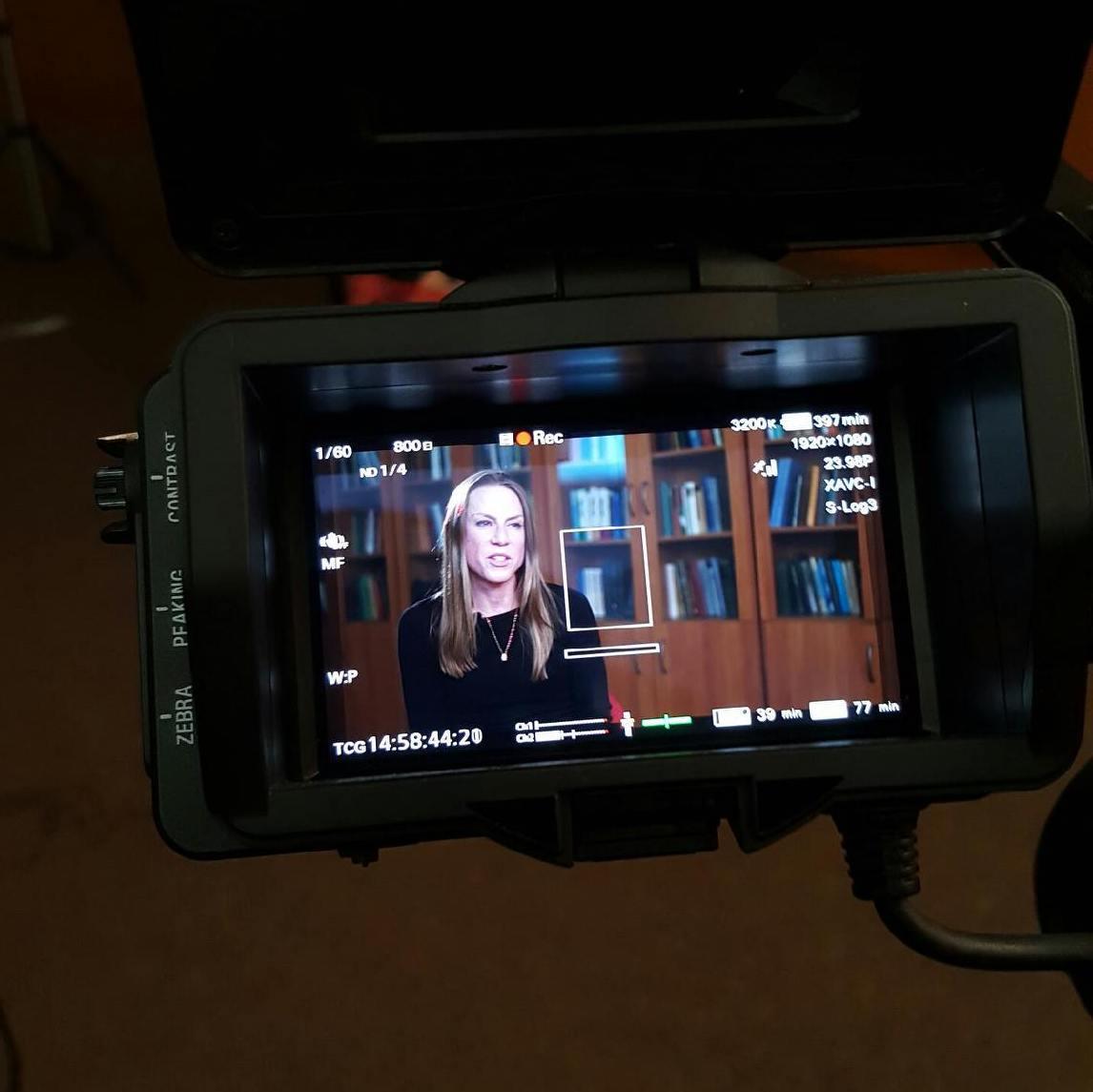 photo of Stanton through video camera viewfinder during interview with Al Jazeera channel October 2016