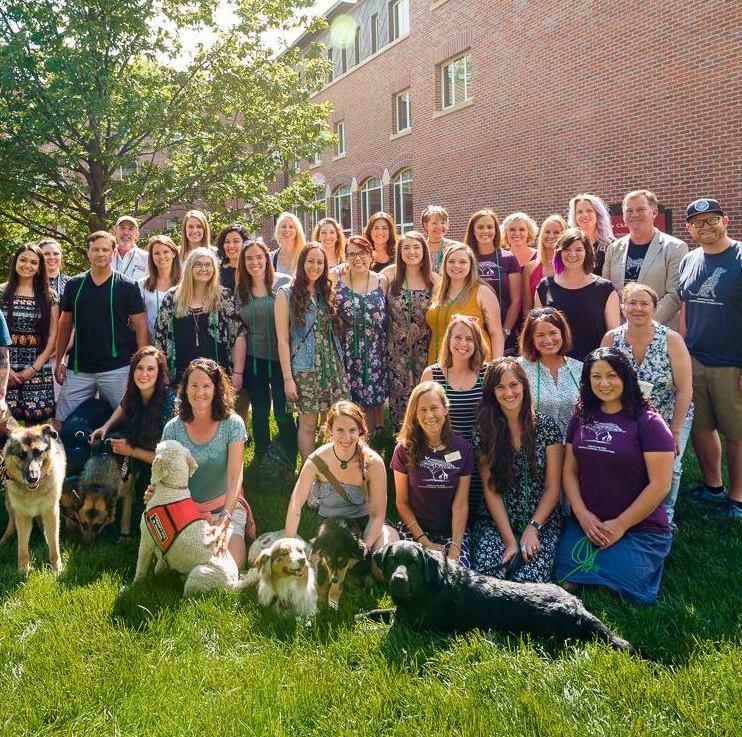 students with dogs outside of Graduate School of Social Work at DU